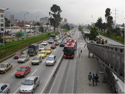 Bogotá: Double lanes at stops permit express buses to pass at stations while “bendy” articulated buses allow greater passenger capacity per bus. Passengers access stations via walkways which bridge highways.