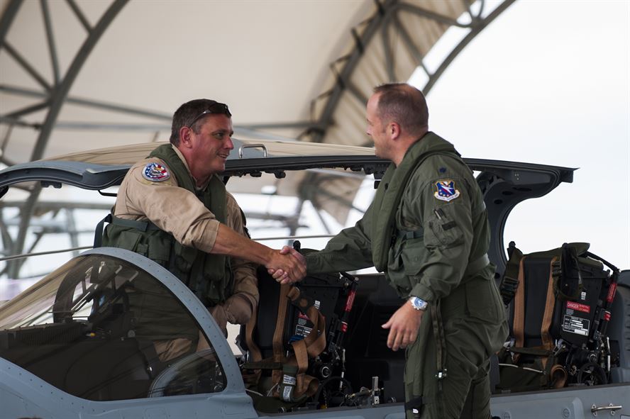 Chris Carlson, left, Sierra Nevada Corporation senior pilot, shakes hands with Lt. Col. Jeffrey Hogan, Afghan A-29 Light Air Support training unit commander, after landing an A-29 Super Tucano for its first arrival Sept. 26, 2014, at Moody Air Force Base, Ga. Moody was selected for the A-29 LAS training mission to train a total of 30 Afghan pilots and 90 Afghan maintainers over the next four years. (U.S. Air Force photo/Airman 1st Class Dillian Bamman) Source: http://www.af.mil/News/Photos/tabid/129/igphoto/2000945466/Default.aspx  